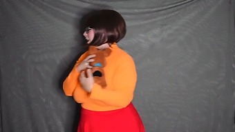 Velma Takes Off Her Clothes In A Seductive Manner