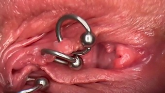 Close-Up Video Of A Woman'S Wet And Pierced Pussy