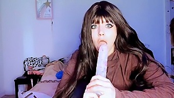 A Young Girl Dominates With A Big Dildo In Oral Sex